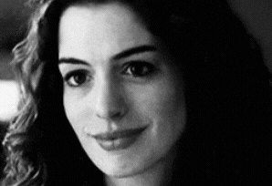 Anne Hathaway raising her eyebrows.
